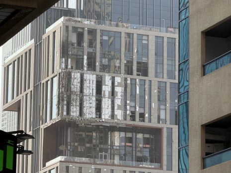 A damaged building in DIFC Dubai after debris from an interception caused damage to the facade in Dubai, UAE