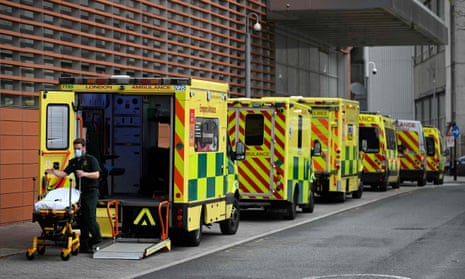 A paramedic and ambulances outside the Royal London Hospital, east London, 12 November 2021.