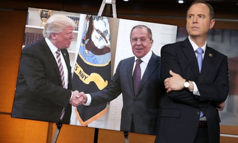 The incoming House intelligence committee chair, Adam Schiff, stands next to a photograph of President Donald Trump and the Russian foreign minister, Sergei Lavrov.