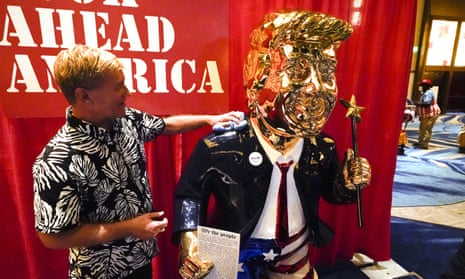 Sculptor Tommy Zegan polishes his statue of Donald Trump at CPAC.