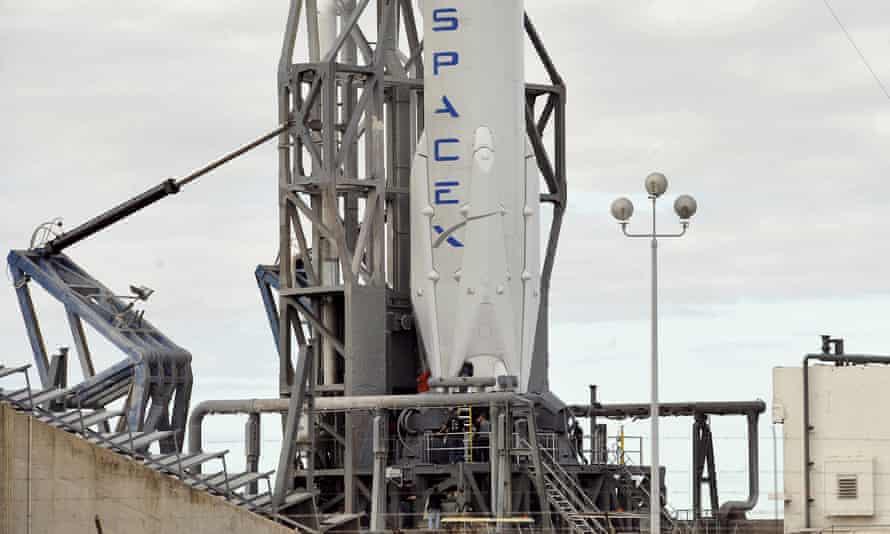 The SpaceX Falcon 9 rocket rests on its pad as it is prepared for launch.