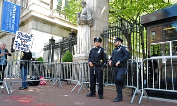 NYPD officers stand at the entrance of Columbia University