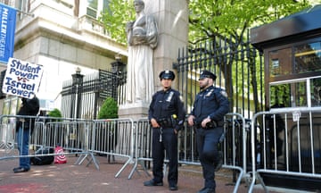 NYPD officers stand at the entrance of Columbia University in New York City on Wednesday.