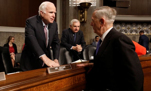 James Mattis greets John McCain prior to testifying.