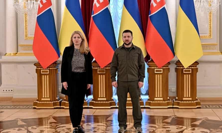 Ukraine’s president Zelenskiy and Slovakia’s president Caputova pose for a picture before their meeting