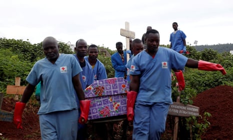 Red Cross workers carry the coffin of an Ebola victim to be buried in the eastern town of Butembo in the Democratic Republic of the Congo