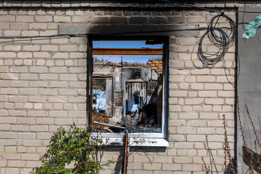 A glassless window opens to a destroyed home after Russian shelling in Novovorontsovka, just 10km north of the frontline between Russian and Ukrainian troops in Kherson.