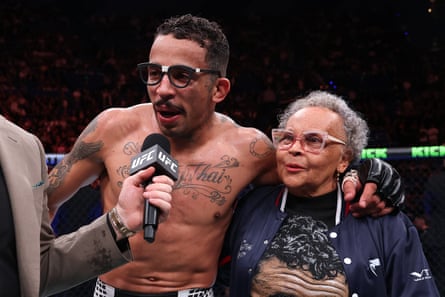 Carlos Prates celebrates with his mother after the win
