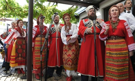 A Cossack choir serenades Austrian foreign minister Karin Kneissl and her groom Wolfgang Meilinger at their wedding.