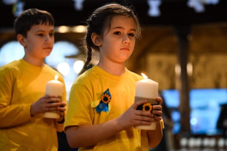 Children hold candles at the start of the ecumenical prayer service at Ukrainian Catholic Cathedral in London.