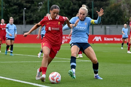 Mia Enderby takes on Alex Greenwood of Manchester City during a pre-season friendly.