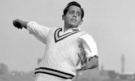Srinivas Venkataraghavan is pictured bowling.