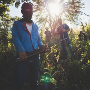 Forgotten GuerreroMexico; Guerrero; Petlacala; 23/11/18 Members of a self defense group in a poppy field. The self-defence group of Sierra of San Miguel claim to protect the local population from the criminal group of the Tequileros, which are specialized in kidnapping and extortion, and at the same time take part in the heroin business.