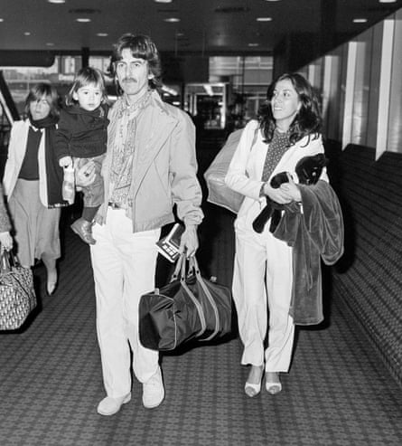 George Harrison with his second wife, Olivia, and their son, Dhani, at Heathrow airport in 1980