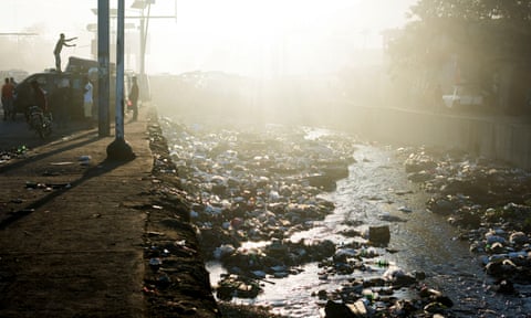 Sewage and rubbish mingle in a river at Port-au-Prince, Haiti