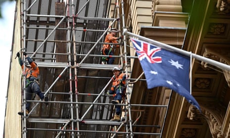 Labourers work at a construction site in central Sydney 