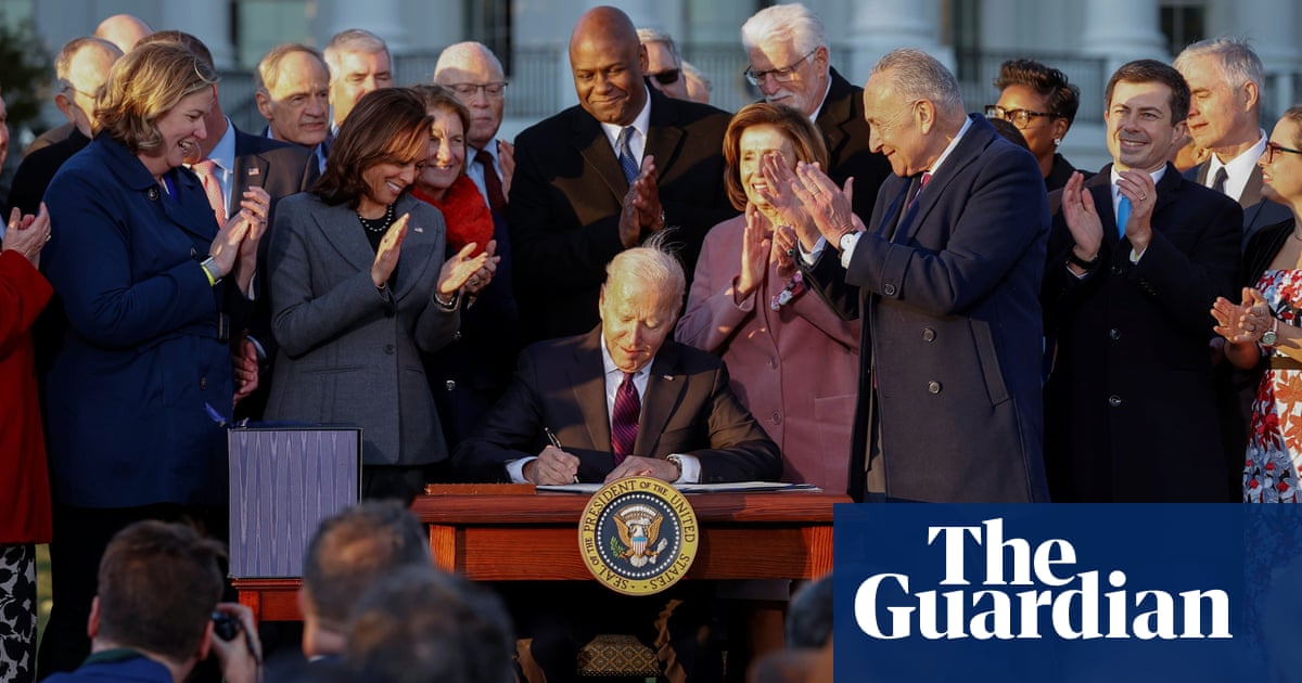 ‘America is moving again’: Joe Biden signs hard-fought $1tn infrastructure deal into law