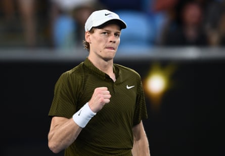 Jannik Sinner clasps his fist in celebration