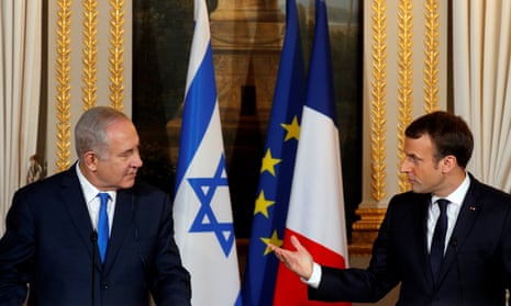 Benjamin Netanyahu and Emmanuel Macron attend a joint news conference at the Elysée Palace in Paris