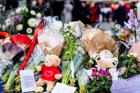 Flowers and stuffed animals are laid in tribute to the victims near the area where a fire broke out at the Le Constellation bar during a New Year's celebration, in Crans-Montana, Switzerland.