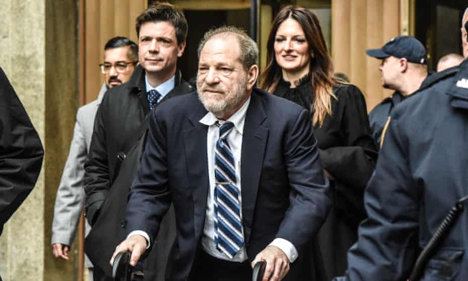 Harvey Weinstein leaves the New York criminal court on Thursday, trailed by his lead lawyer, Donna Rotunno (behind, to the right).