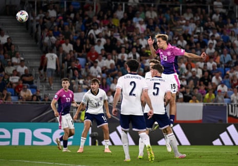 Nelson Weiper jumps above the England defence to head the ball into the England goal.