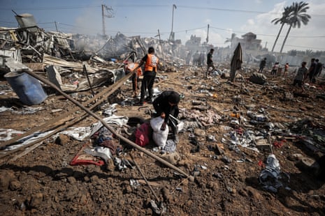 A view of the destroyed camp, which houses displaced Palestinians, after Israeli army targeted the camp as Palestinians gather to inspect the site in Deir Al Balah, Gaza on August 21, 2025.