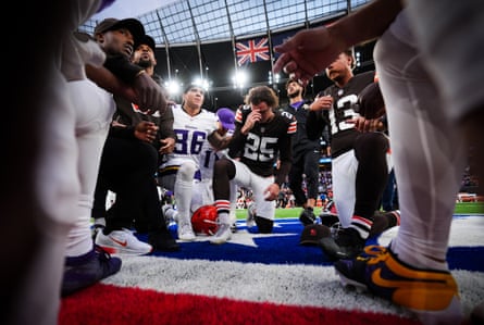 Players pray after the Minnesota Vikings v Cleveland Browns game in Tottenham.