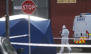 Forensic officer at the
scene of a fatal shooting in Dublin's Sheriff
Street