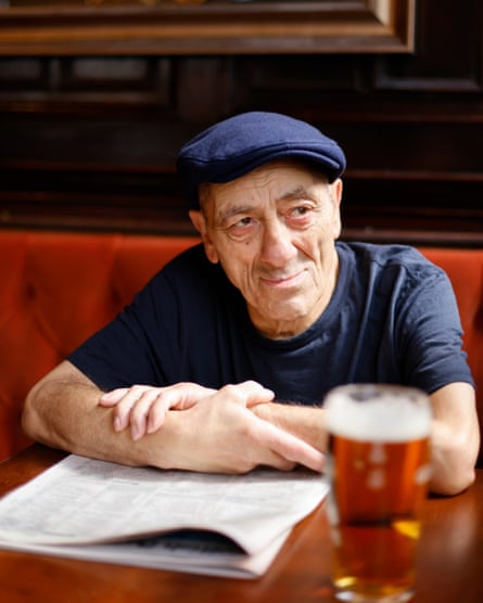 Andy Linden sits in a pub with a newspaper and a pint of beer