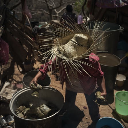 Cristina Bautista helps cooking tamales