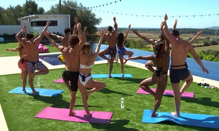 Love Island contestants doing couple's yoga