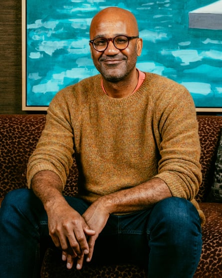 a photograph of a man successful a sweater