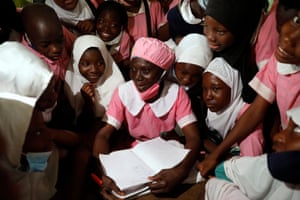Shade Ajayi, 50, chats to some of her classmates after class at the Ilorin grammar school.