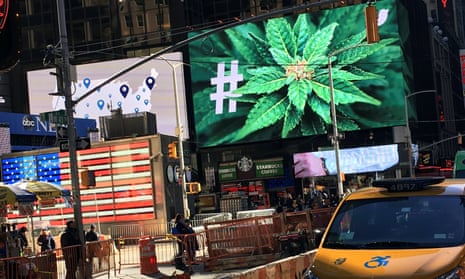 An electronic billboard displays a marijuana hashtag at Times Square in New York.