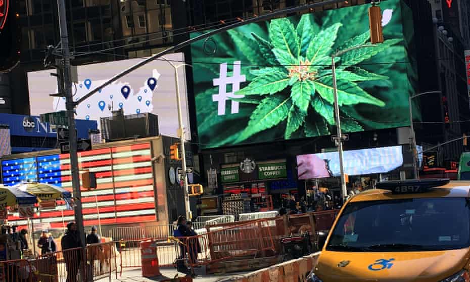 An electronic billboard displays a marijuana hashtag at Times Square in New York.