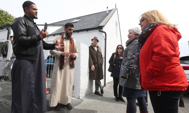 Aihtsham Rashid (second left) speaks to local people during the official opening of the mosque in Stornoway on the Isle of Lewis. 