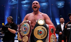 Tyson Fury shows off the belts after beating Wladimir Klitschko in 2015