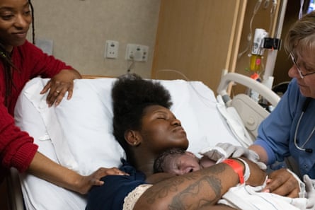 Em’Mae Alexander, 20, holds her newborn daughter, Xhlai Nola Novell moments after her birth.