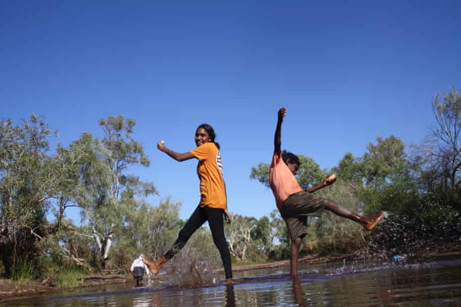 Kids splashing on country at Buriyamangga (Red Rock). The photographer, Karella Walker, is a young participant in the Big hART programs at Ieramugadu.
