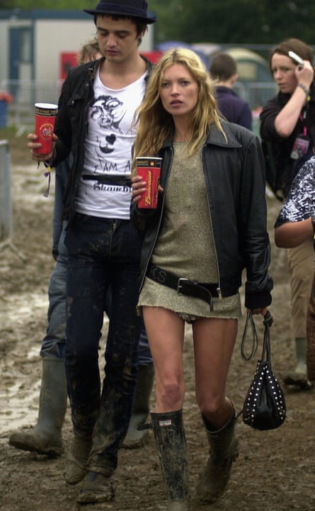 Kate Moss and Pete Doherty walk backstage on the second day of the Glastonbury music festival 2005 at Worthy Farm, Pilton on June 25, 2005 in Somerset, England. Pete Doherty was at the festival to perform with his band Babyshambles.