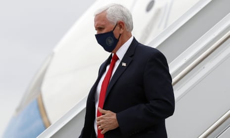 Mike Pence wears a face mask as he arrives in Dallas Sunday.