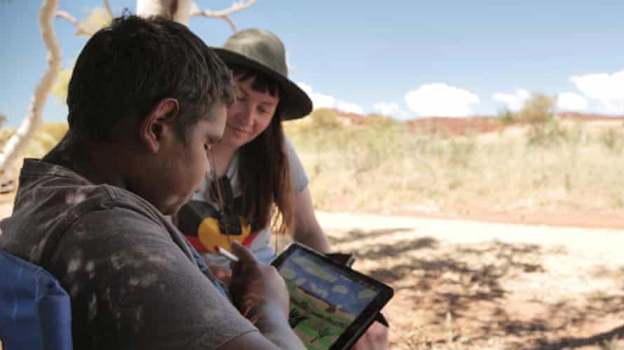 Everard Woodley with April Phillips on country at Murujuga National Park as part of the Big hART programs.