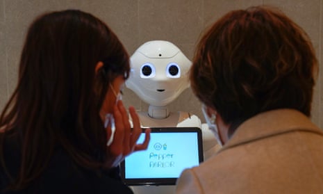 Pepper, a robot developed by SoftBank Robotics, welcomes customers in Tokyo, Japan, on 5 November. In the US, 11 million people were unemployed in October.