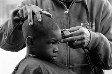 a young boy getting a haircut