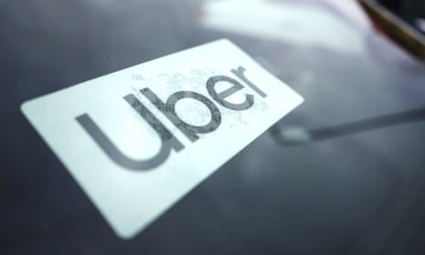 File photo of an Uber sign in a car