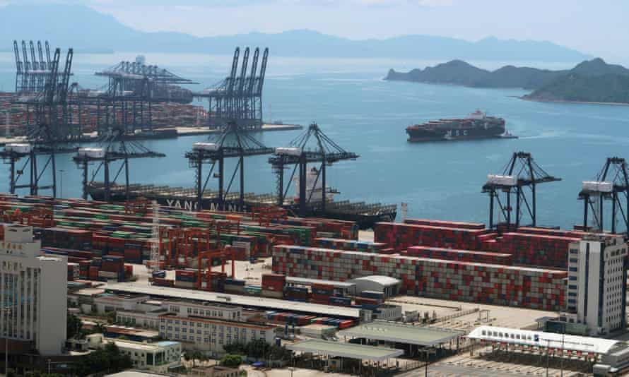 A cargo ship carrying containers is seen near the Yantian port in Shenzhen following the Covid-19 outbreak in Guangdong province