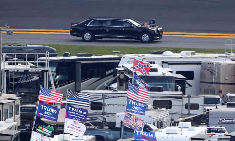 Trump flags are visible in the infield as the presidential motorcade arrives prior at Daytona International Speedway. 
