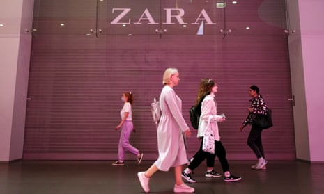 People walk past a closed Zara store in St. Petersburg. Zara exited Russia in March, but its clothes are being imported indirectly and sold in stores.