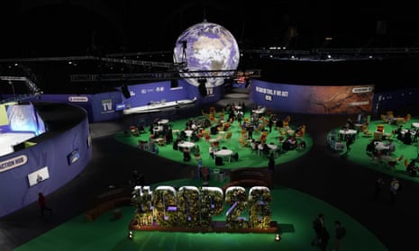 People gather in the Action Zone inside the venue for the COP26 U.N. Climate Summit in Glasgow, Scotland, Monday, Nov. 8, 2021.